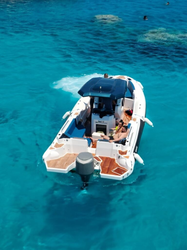 VIP speedboat from above over a coral reef